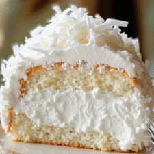 Coconut Cloud Cake: A Heavenly Slice of Paradise That Melts in Your Mouth