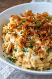 French Onion Chicken Orzo Casserole takes everything we love about traditional French onion soup and transforms it into a complete, hearty meal. Instead of just broth and bread, you're getting protein-rich chicken, satisfying orzo pasta, and all those beautiful caramelized onions that make French onion soup so addictive.