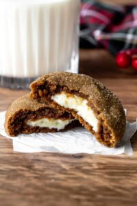 Gingerbread cheesecake cookies represent the best of both worlds – they combine the warm, spicy nostalgia of traditional gingerbread with the rich, tangy luxury of cheesecake. The concept is brilliant in its simplicity: a cream cheese filling wrapped in soft gingerbread cookie dough, then rolled in cinnamon sugar and baked.